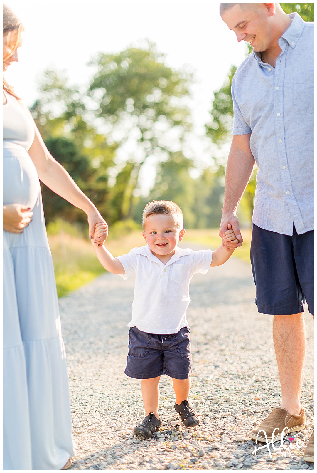 happy two year old boy with parents