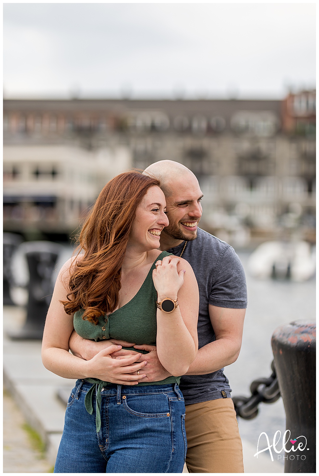 boston engaged couple smiling in seaport