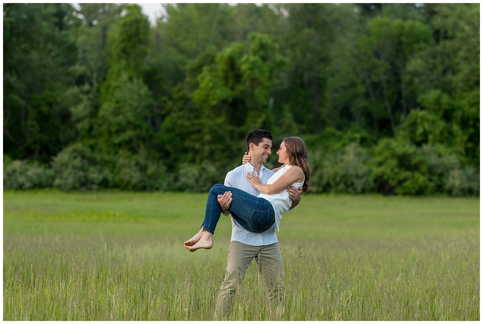 downtown lowell engagement photos in a field