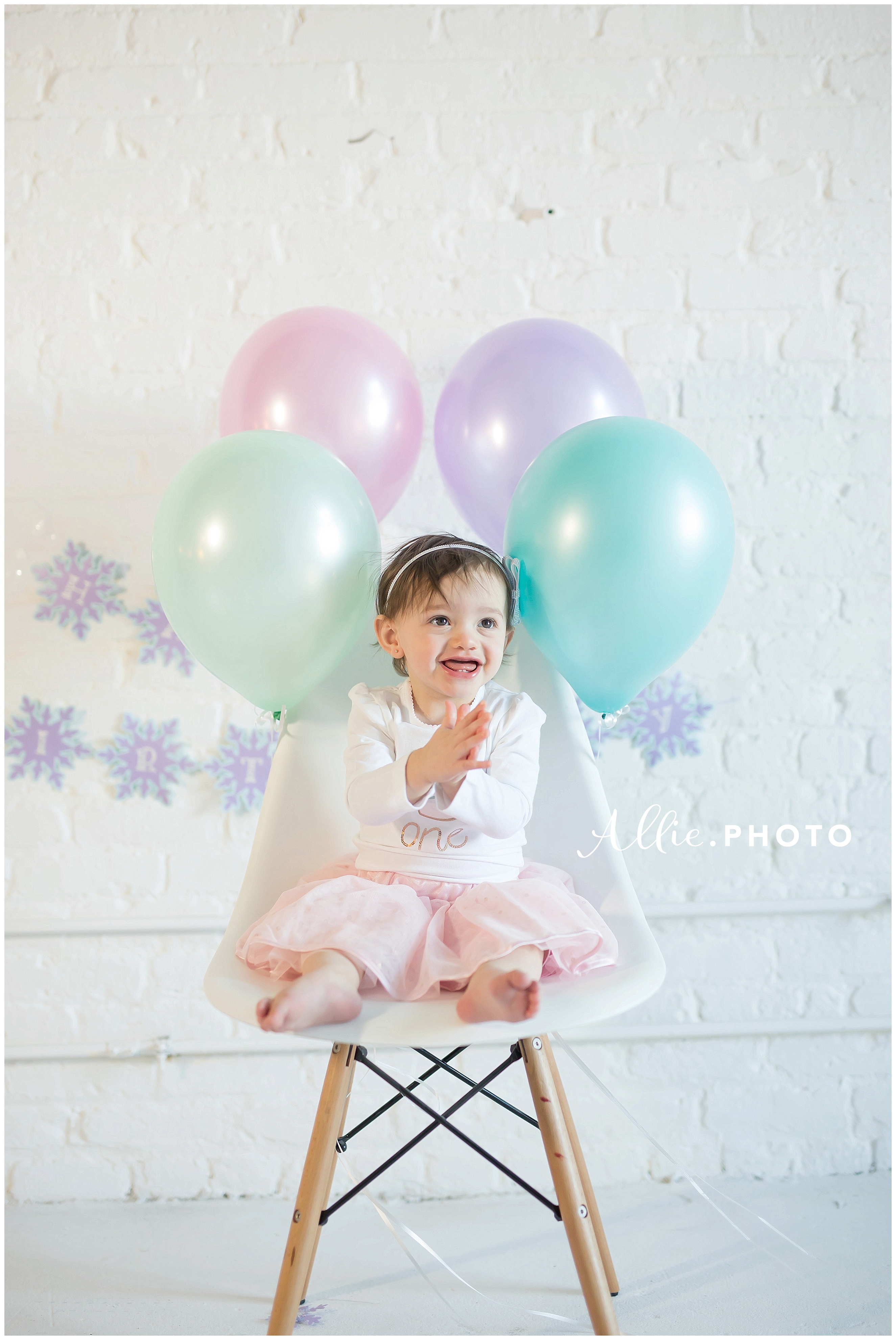 happy-baby-girl-clapping-balloons.jpg