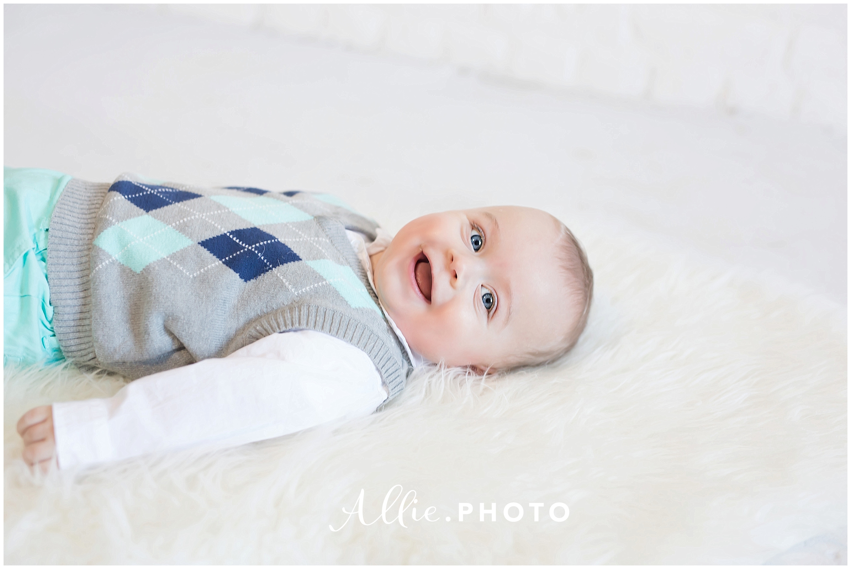 six-month-baby-boy-smile-white-fur-rug.jpg
