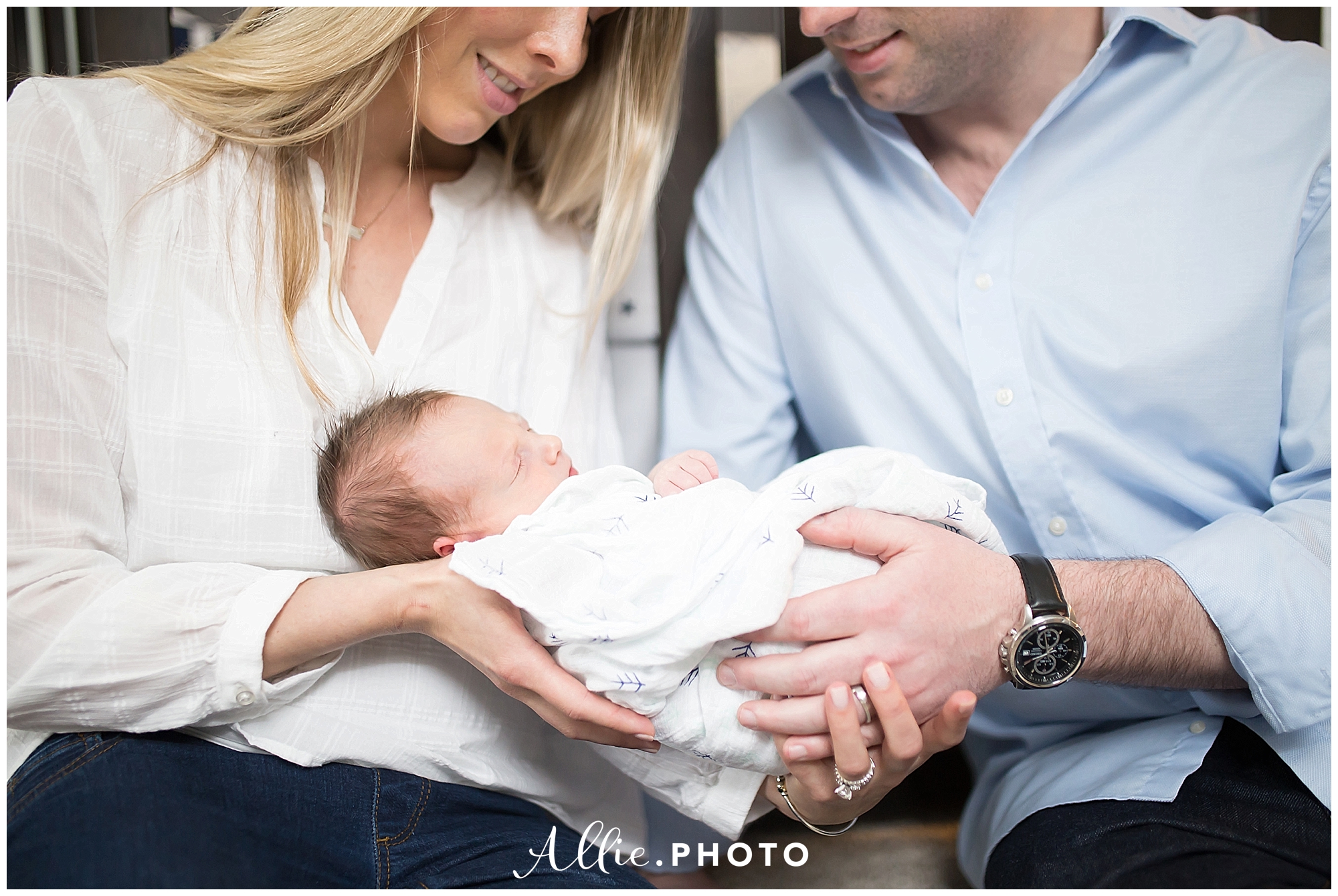 chelmsford_newborn_photographer_lifestyle_baby_boy_parents_holding.jpg