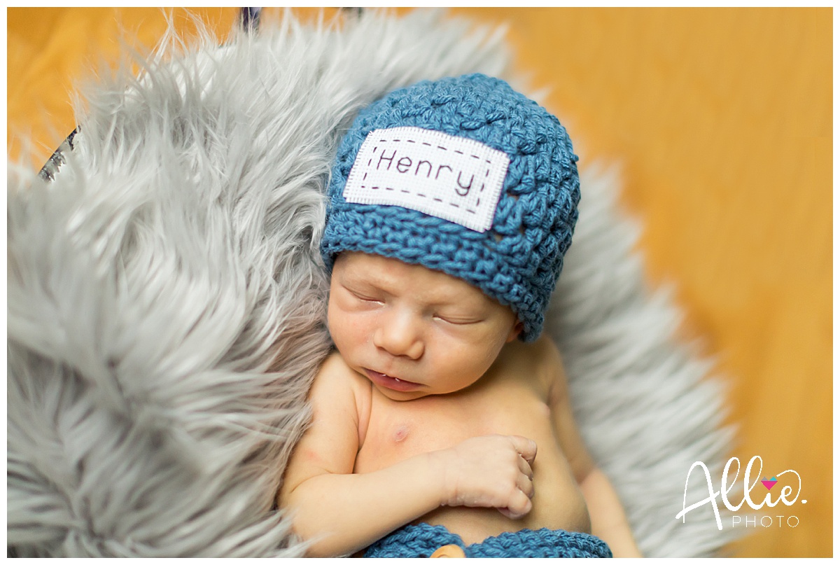 newborn baby with Henry hat