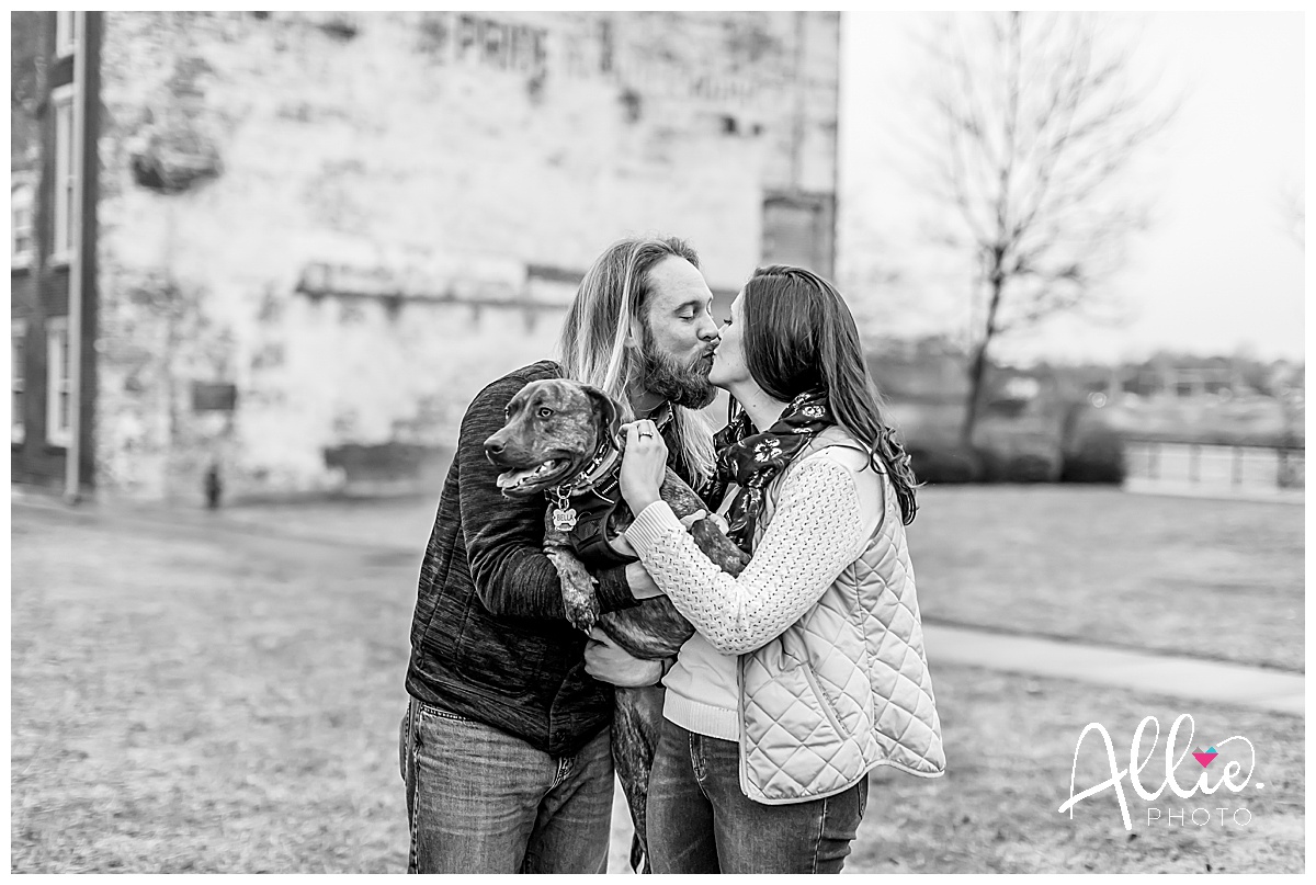 Downtown Lowell engagement photos black and white couple kissing with dog