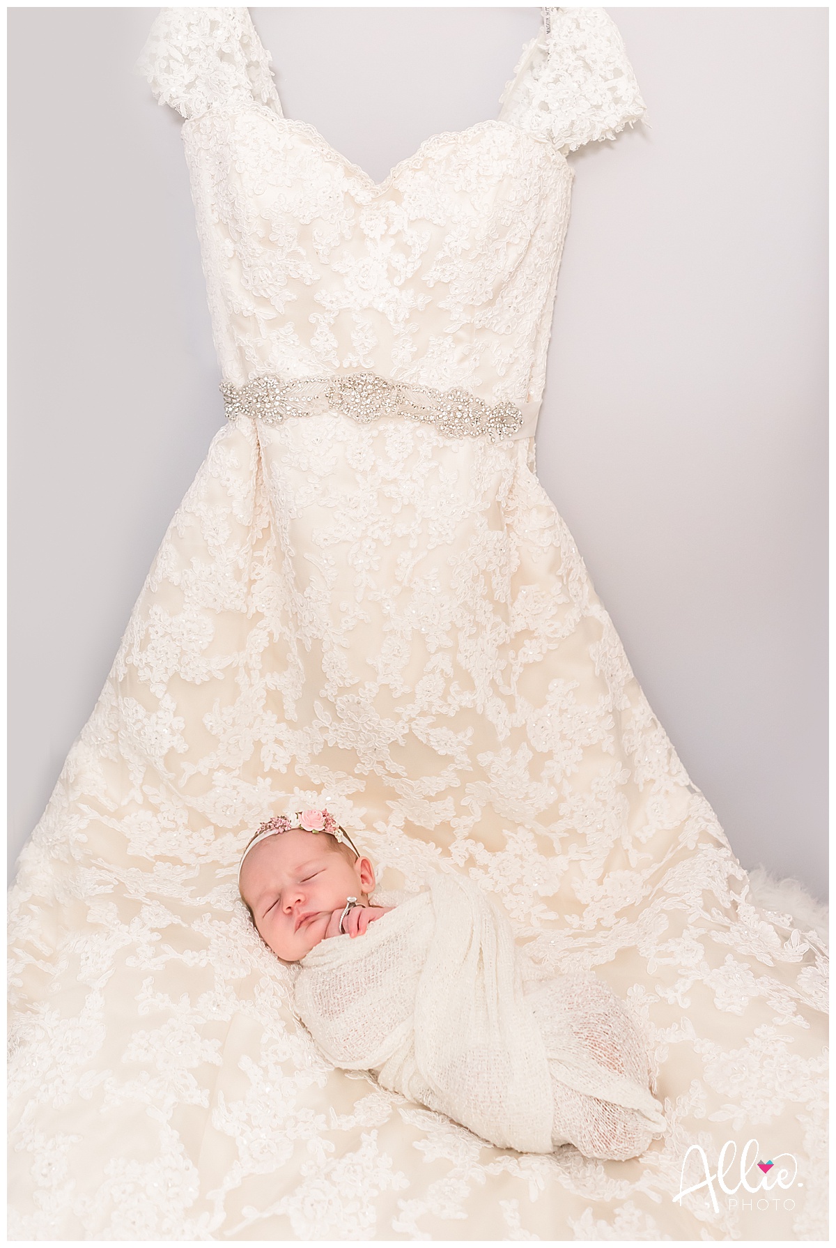 newborn photos at home with wedding dress