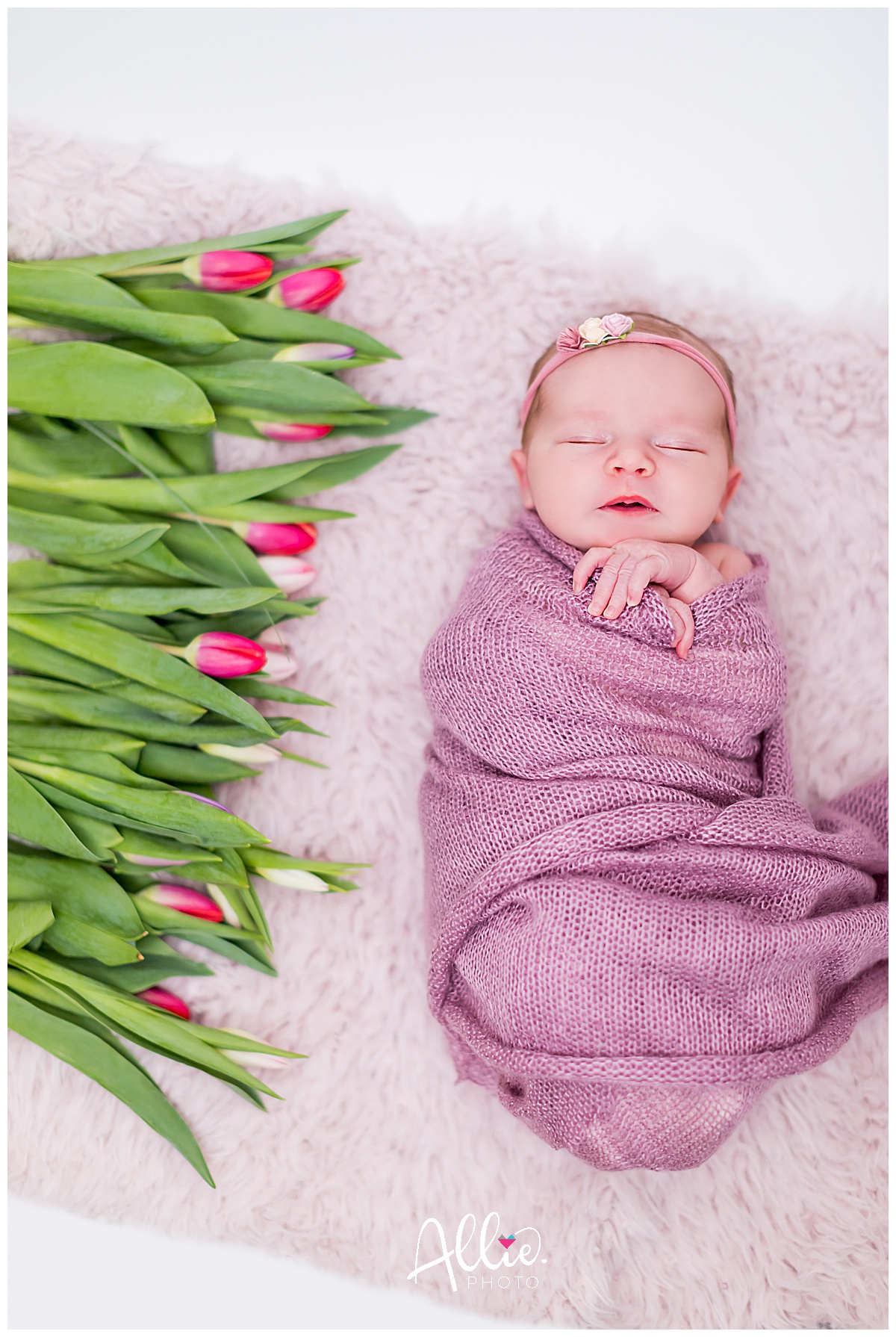 spring newborn baby with tulips