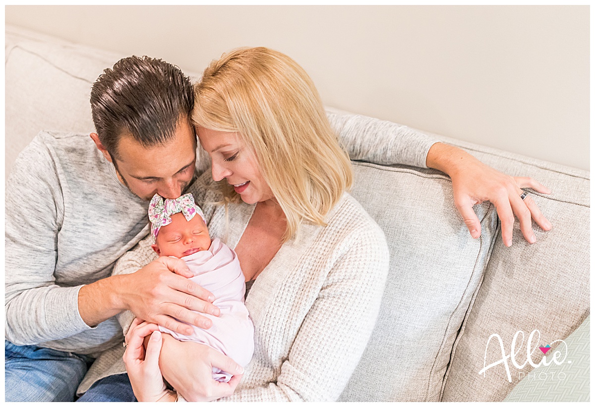 at-home newborn photos with baby on couch