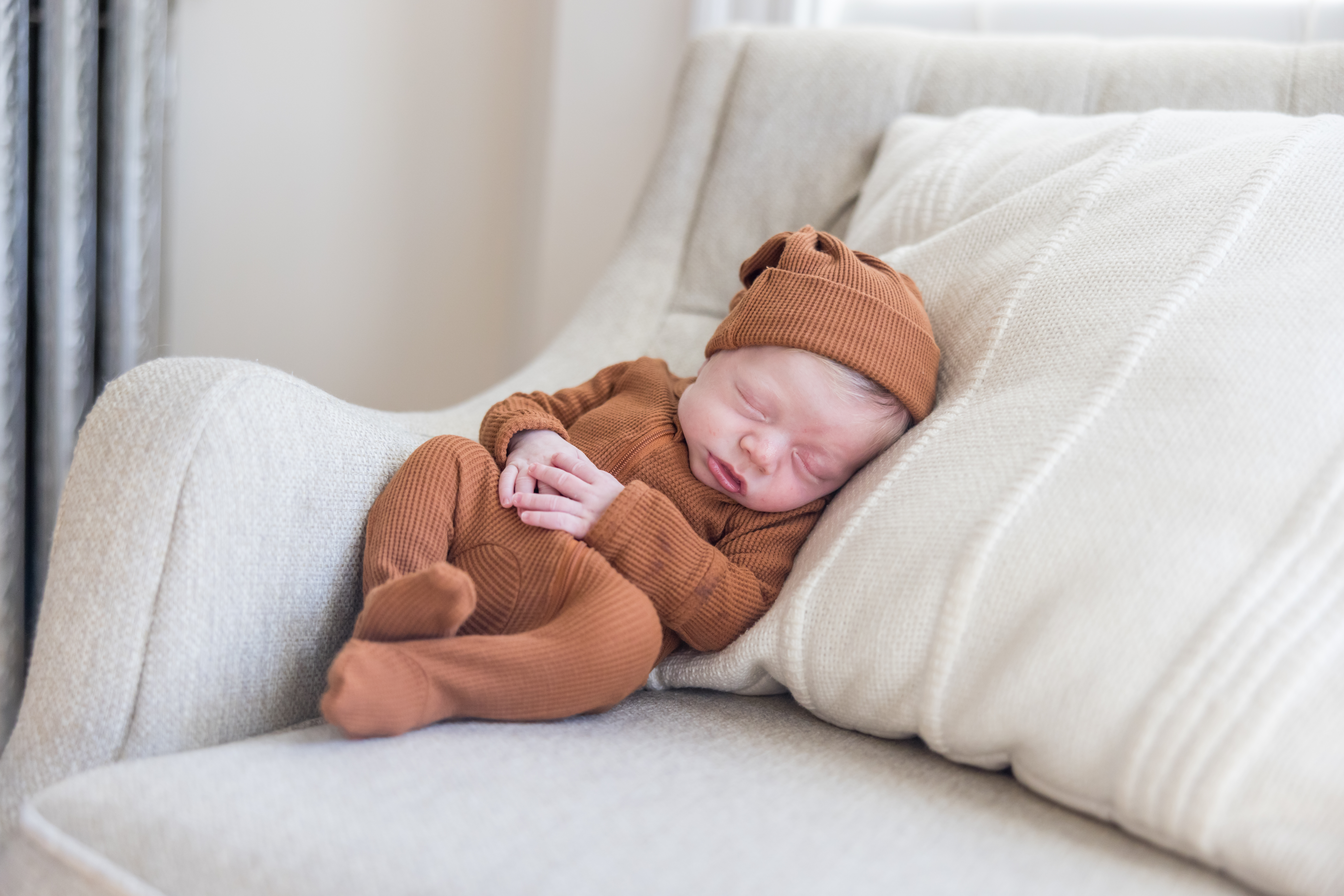 lifestyle newborn baby photos at home baby on couch by boston area photographer